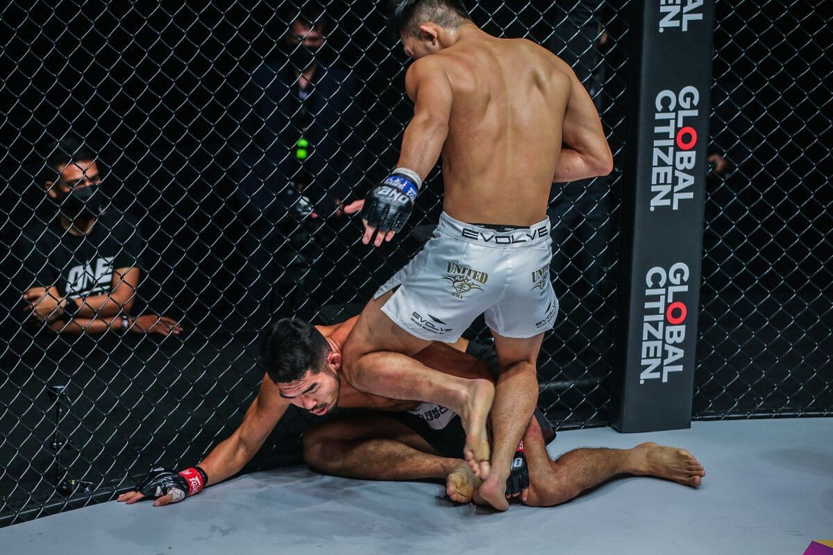 Christian Lee knocks Ok Rae Yoon out with a flurry of knee strikes. [Photo ONE Championship]