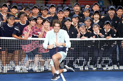 Taylor Fritz poses after winning the Japan Open title.