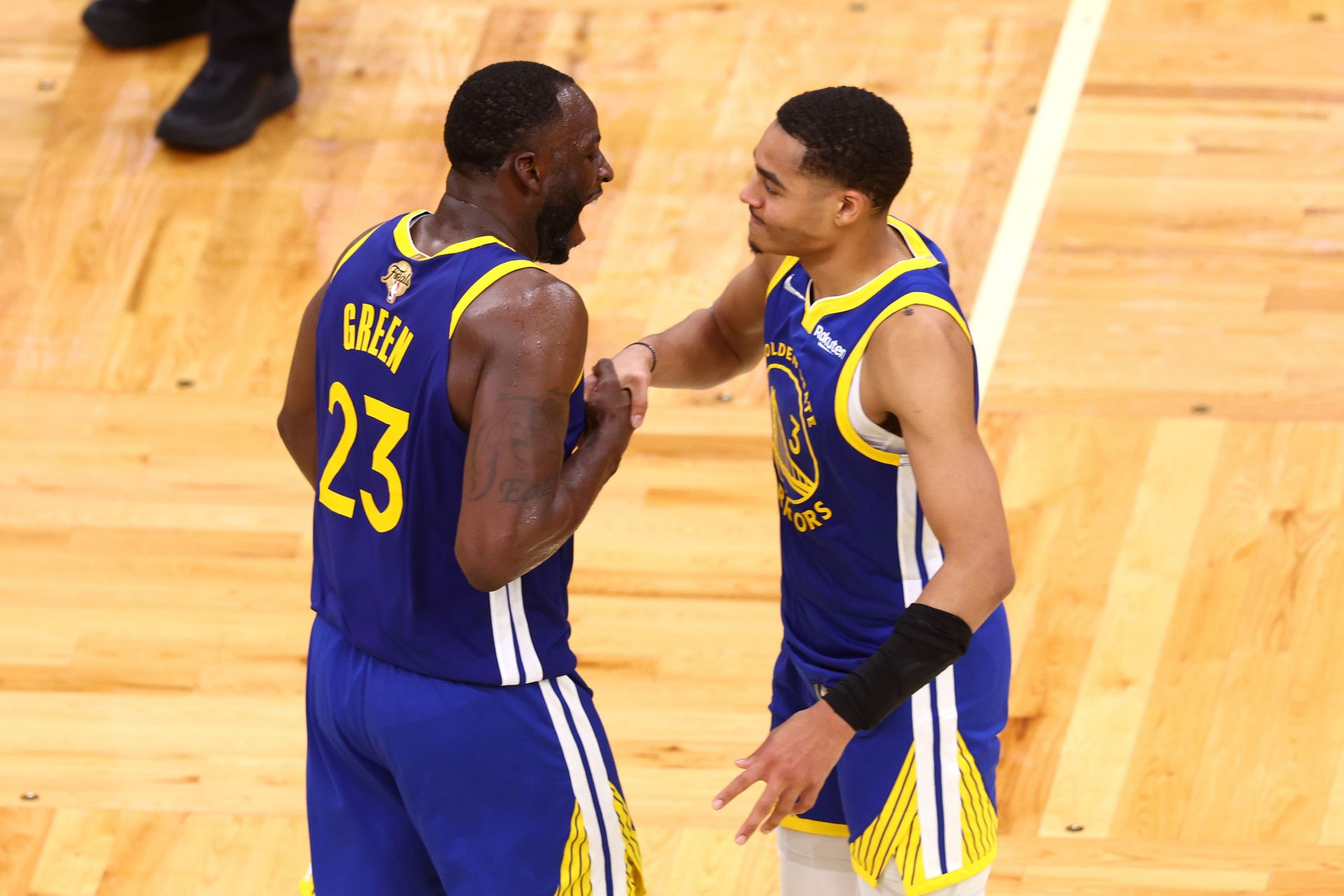 Draymond Green and Jordan Poole of the Golden State Warriors