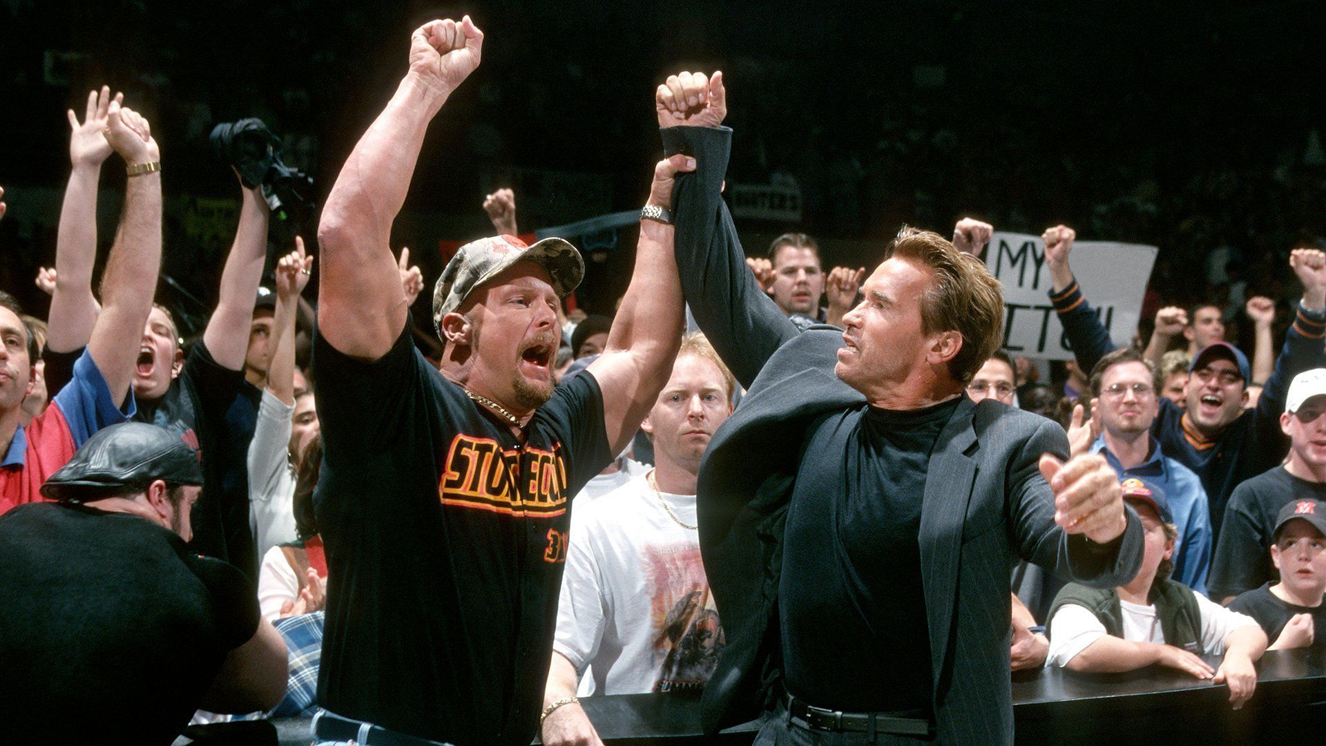 Arnold Schwarzenegger and Steve Austin (Image via WWE)