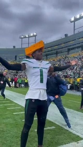 Green Bay Packers fan has cheese sauce poured over his head by