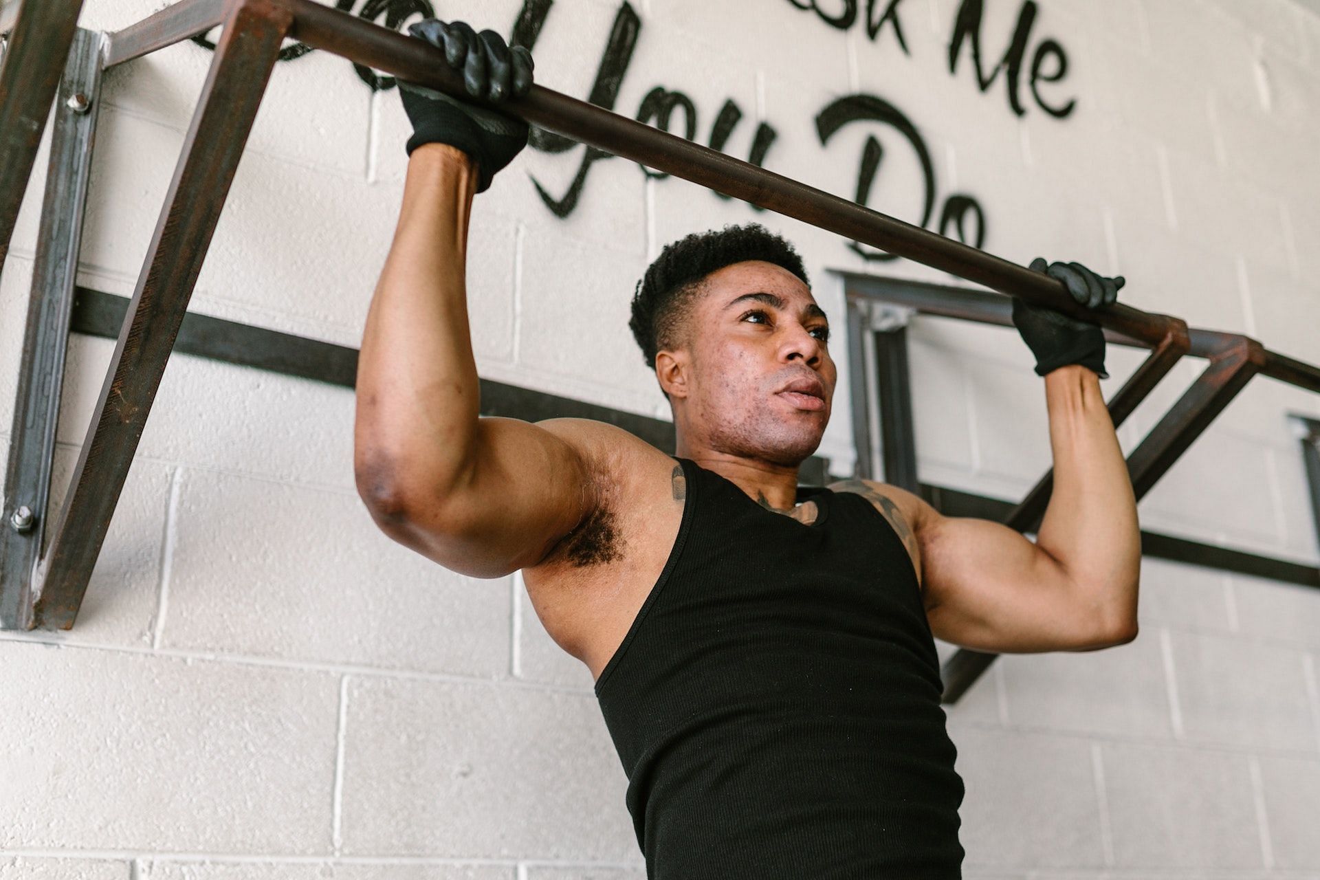Pull-up bar exercises help strengthen the upper body. (Photo via Pexel/RODNAE Productions)