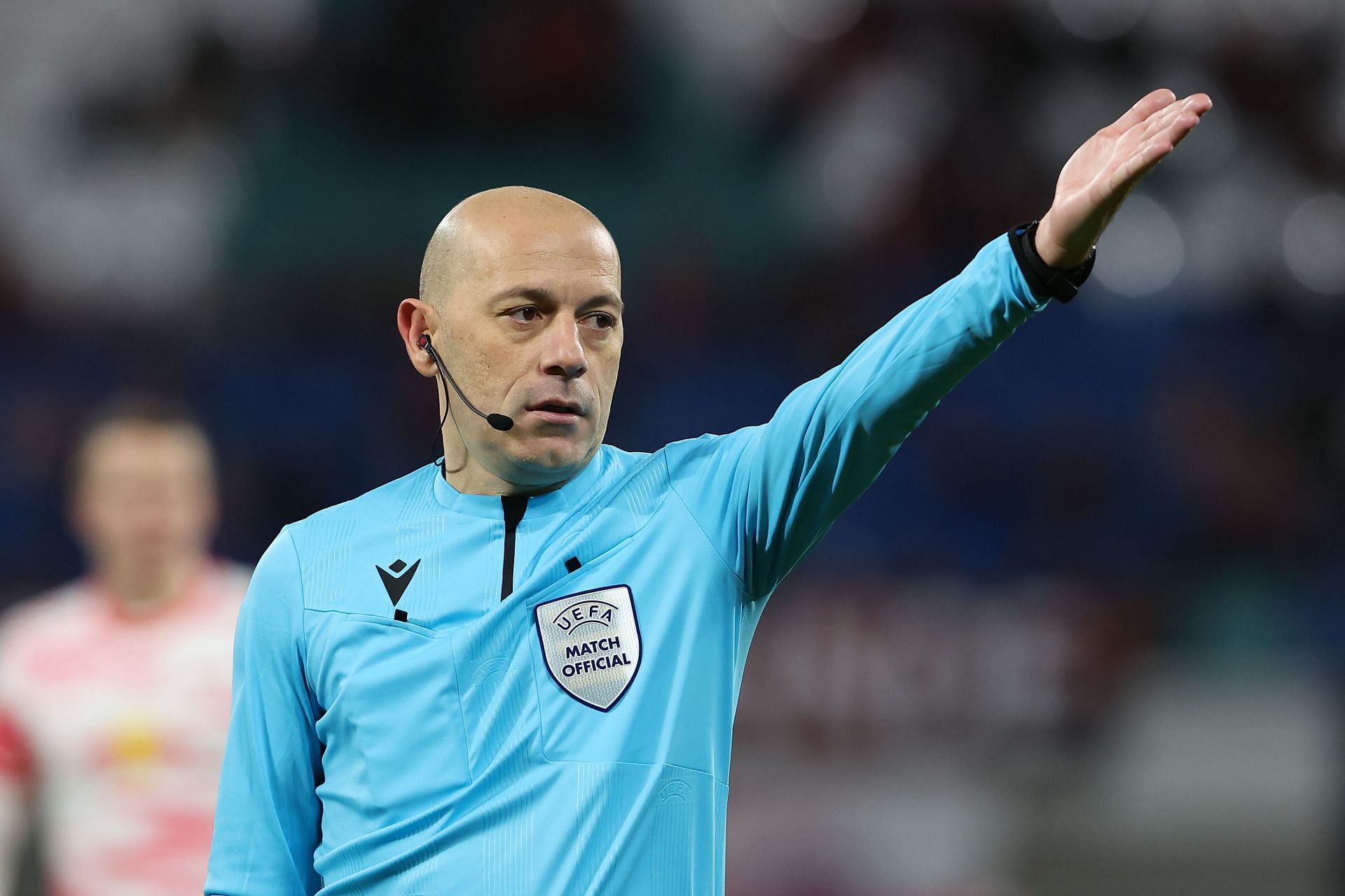 Referee C&uuml;neyt Cakir reacts during the UEFA Europa League Knockout Round Play-Offs Leg One match between RB Leipzig and Real Sociedad.