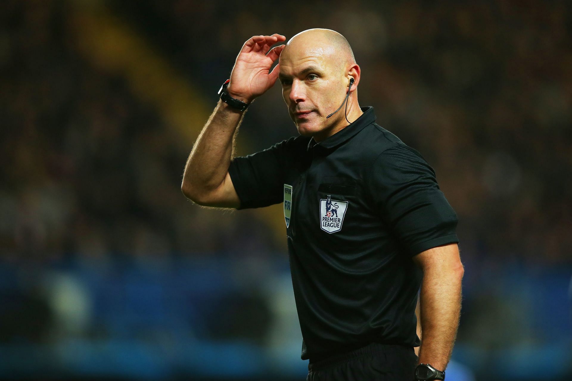 Referee Howard Webb looks on during the Barclays Premier League match between Chelsea and Liverpool at Stamford Bridge on December 29, 2013.