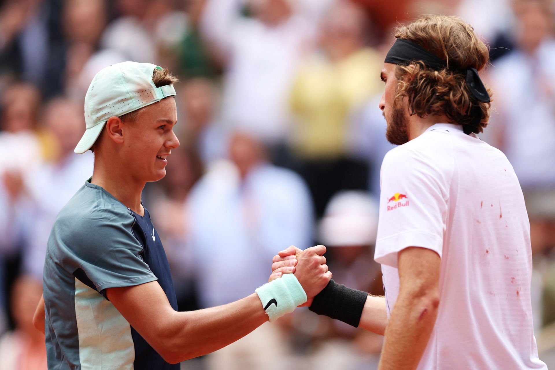 Holger Rune and Stefanos Tsitsipas at the 2022 French Open.