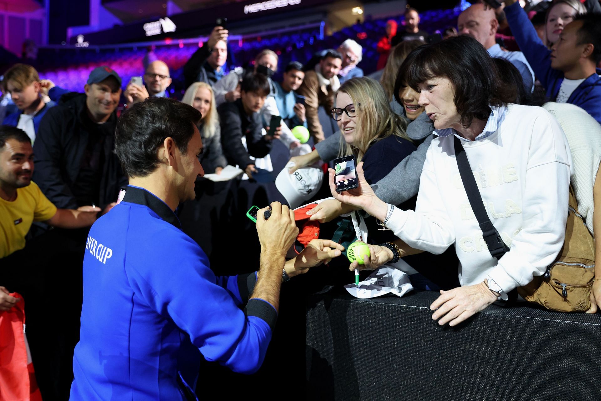 Roger Federer signing autographs during the Laver Cup