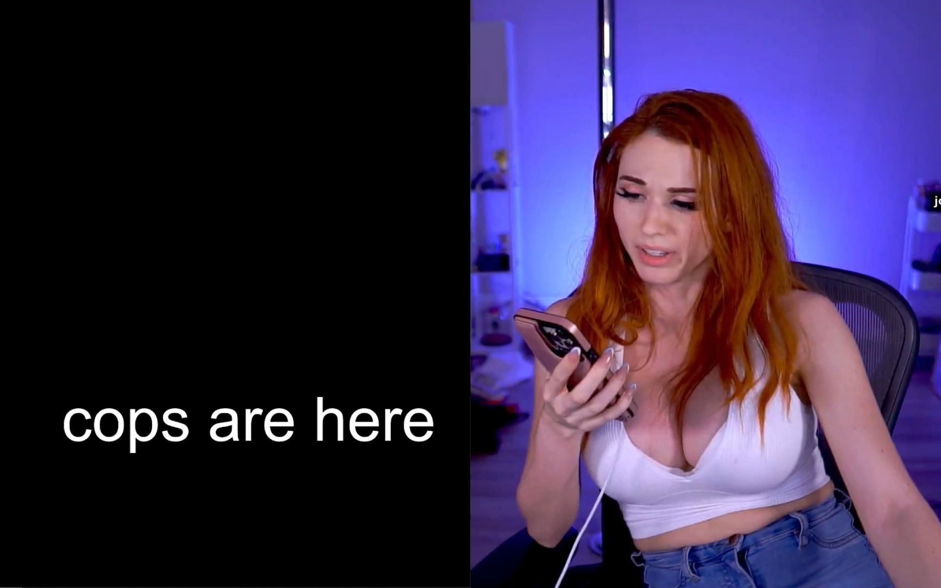 Amouranth writes a message during the introduction screen of the October 18 livestream (Image via Sportskeeda)