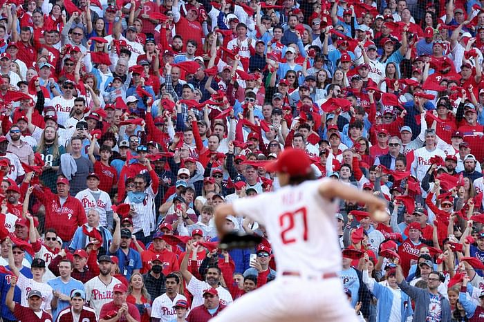 Phillies fan taunting Braves fans and players by doing the chop at