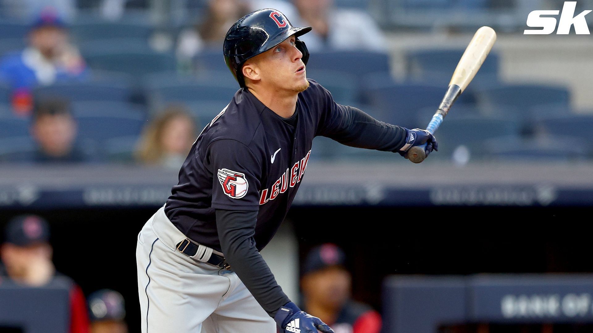 Fans throw debris onto field, at Guardians players following