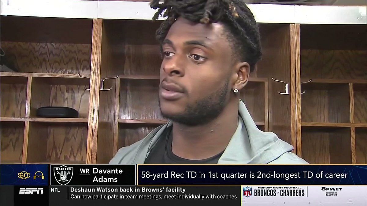 Las Vegas Raiders' Davante Adams pushes camera man following ugly loss