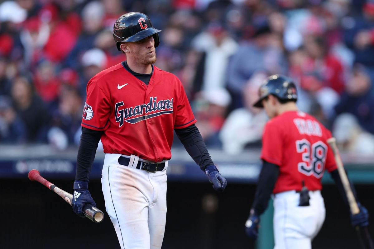 Cleveland Guardians slugger Myles Straw throws a football around with