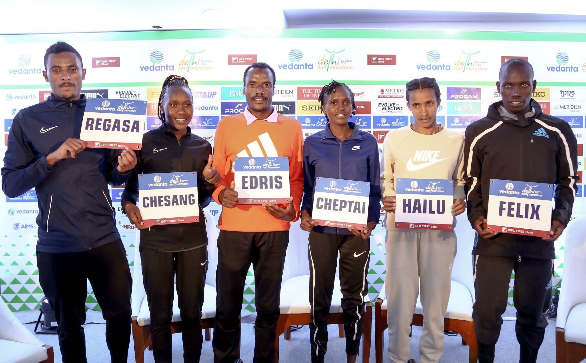 Foreign athletes pose for a picture on Friday in Delhi. The competitors will compete at the Delhi Half Marathon on Sunday. 