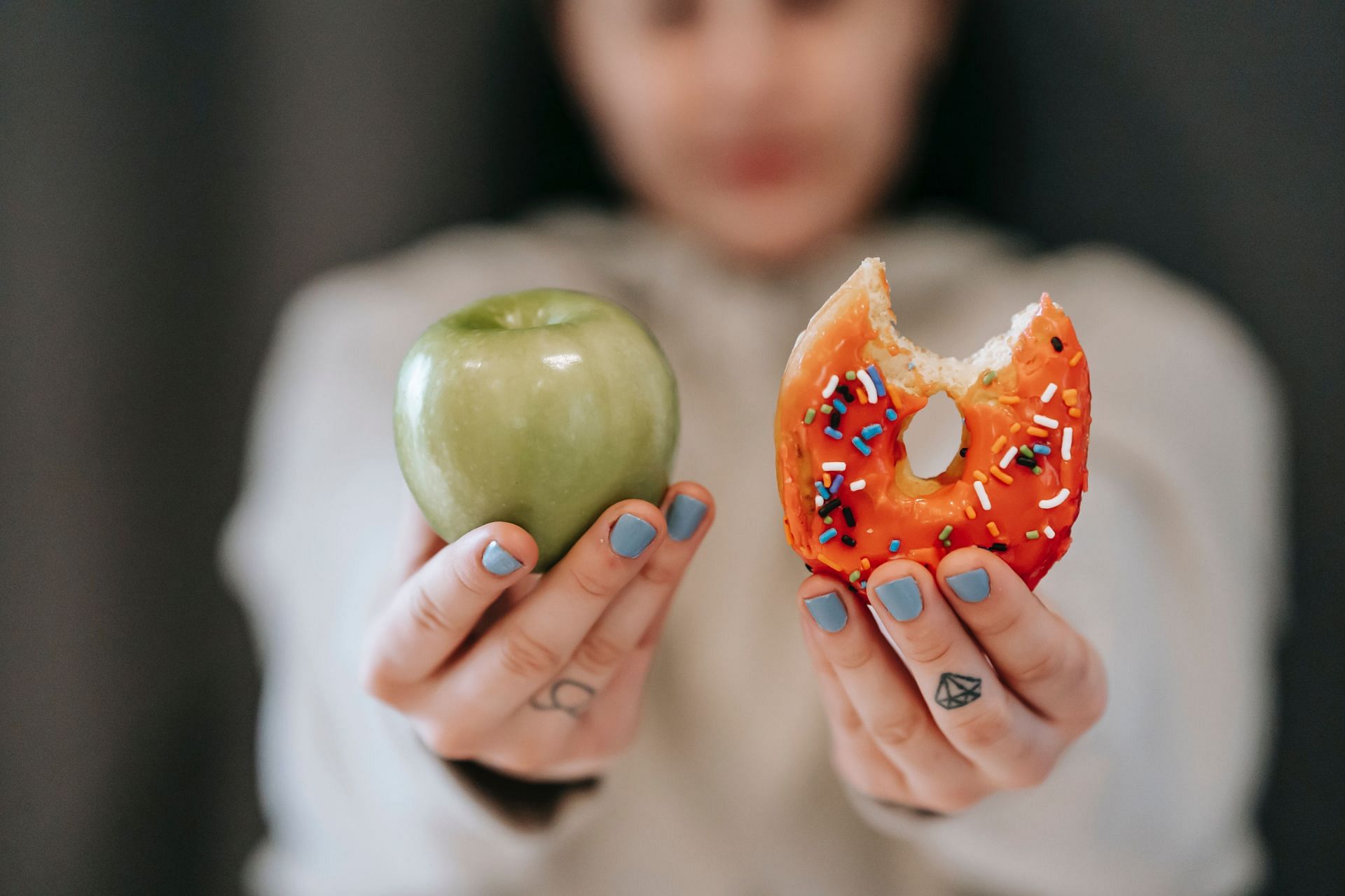 Although the doughnut will be more alluring, having a fresh fruit is better for you when undergoing menopause (Image via Pexels @Andres Ayrton)