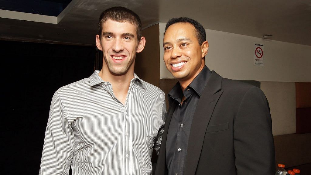 Michael Phelps and Tiger Woods (Image via Getty Images/Mike Stobe)