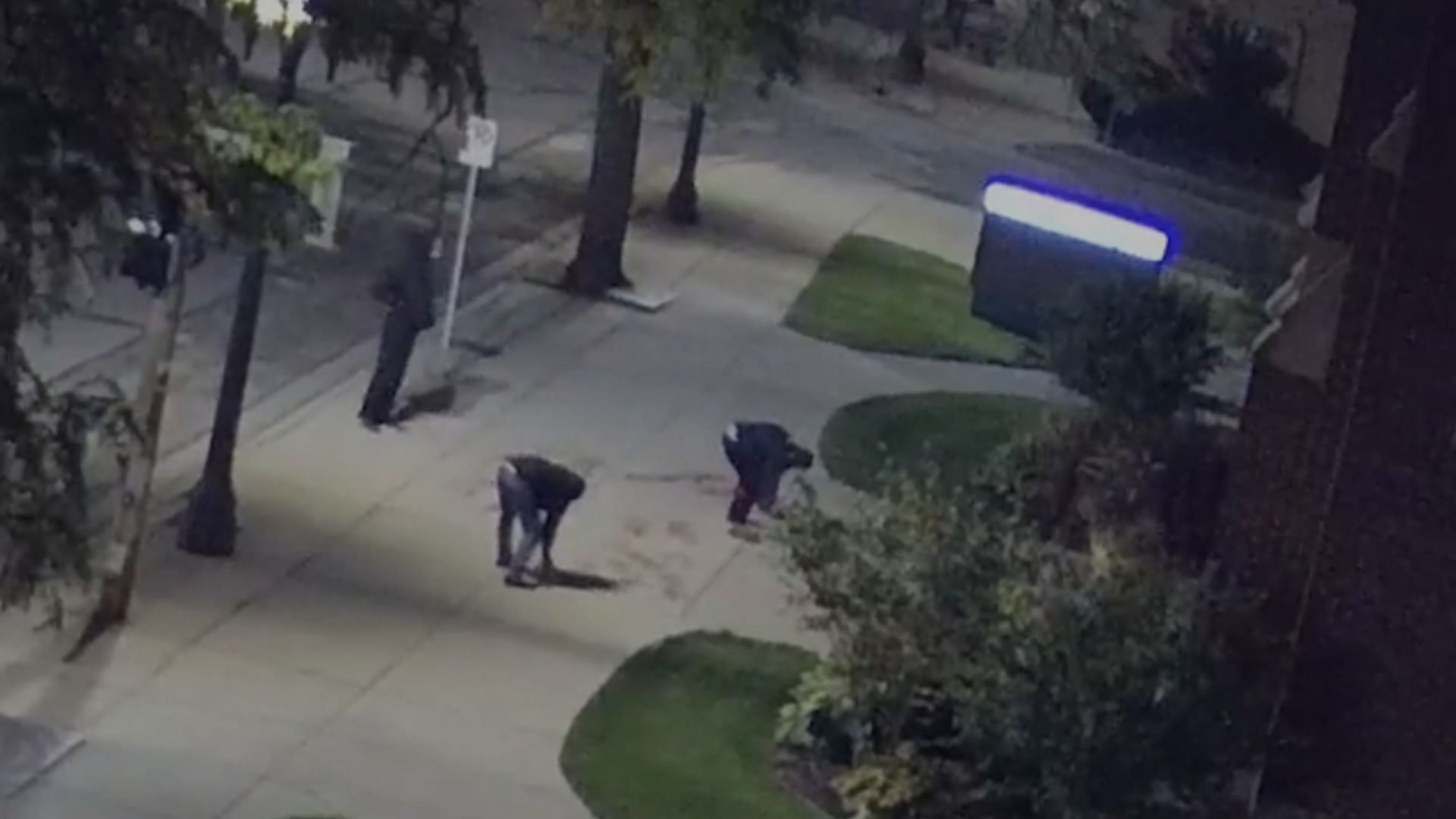 Security footage shows vandals spray painting pro-abortion messages on a church sidewalk (Image via the Diocese of Lansing) 