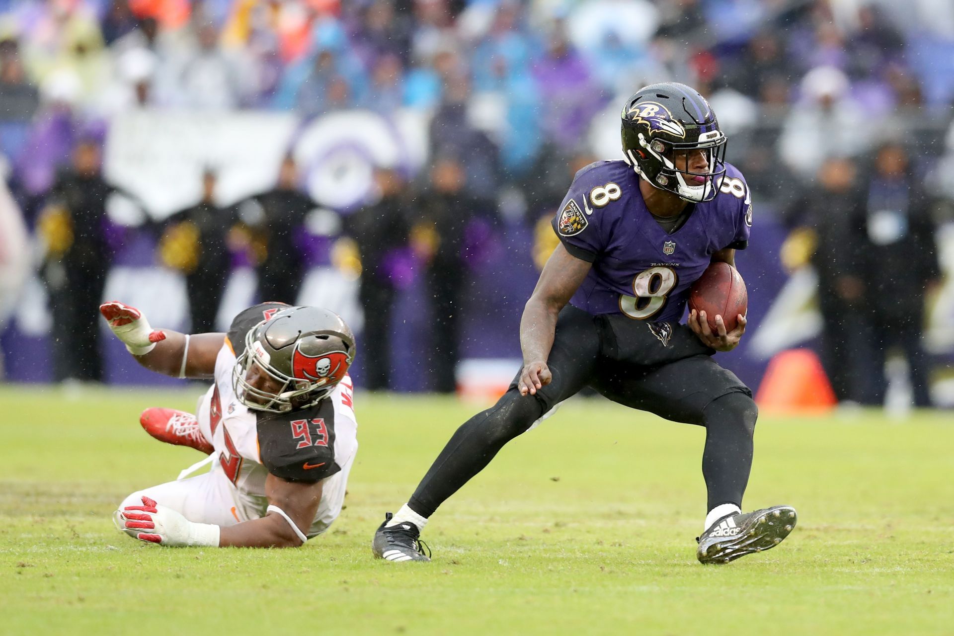 Lamar Jackson evades a defender