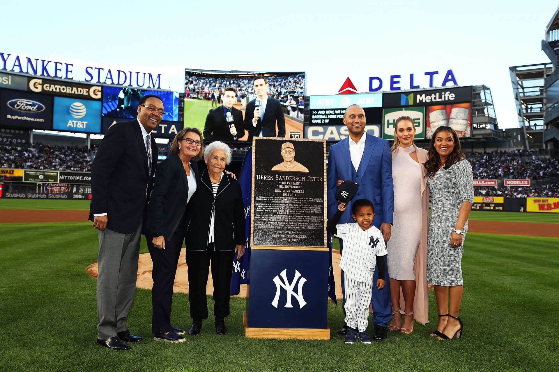 Derek Jeter poses with his family during the retirement ceremony of his number 2 jersey at Yankee Stadium on May 14, 2017 in New York City.