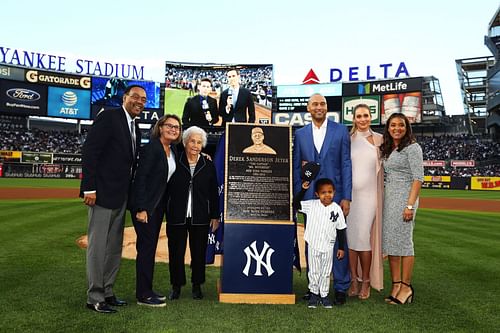 Derek Jeter poses with his family during the retirement ceremony of his number 2 jersey at Yankee Stadium on May 14, 2017 in New York City.