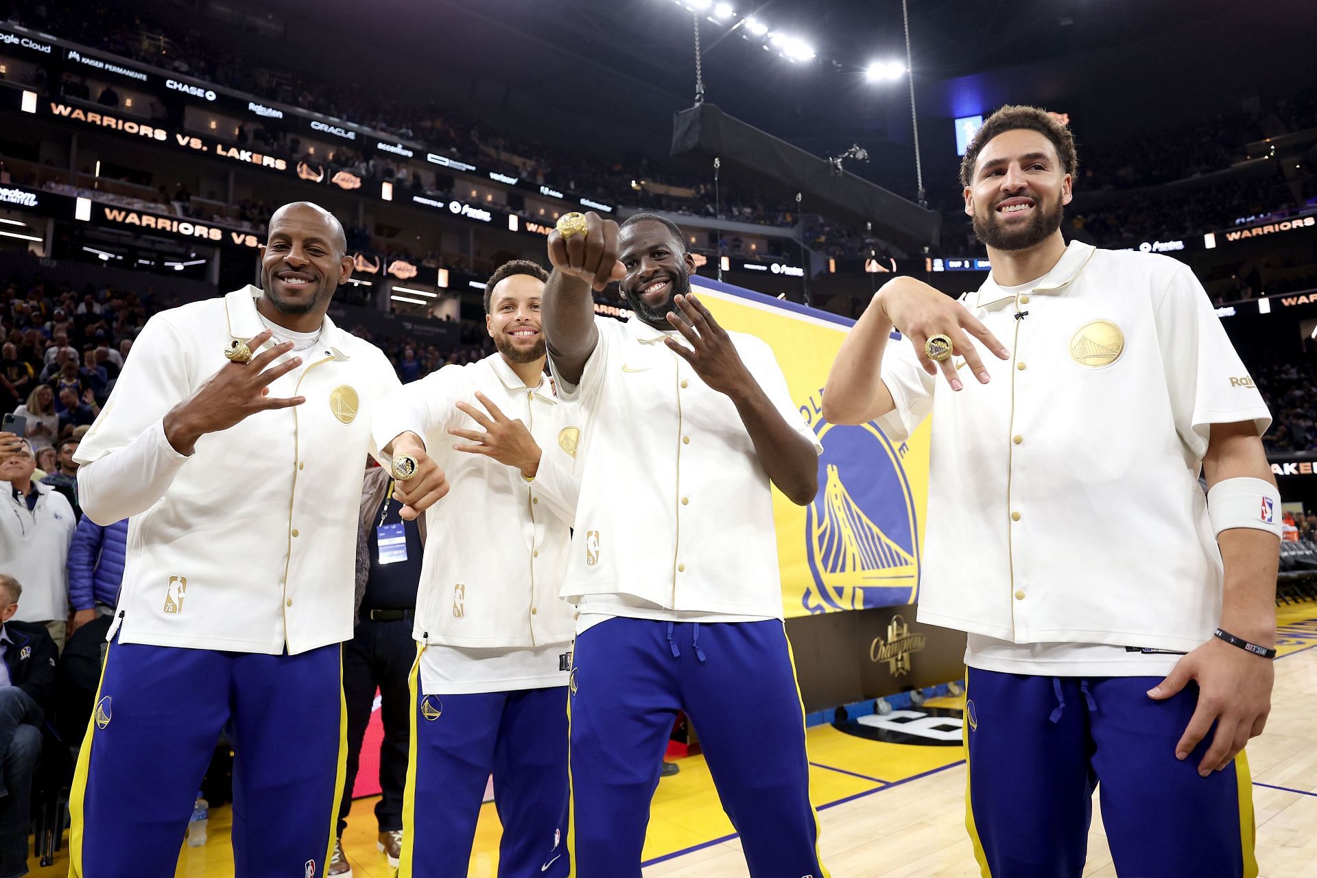 Andre Iguodala, Stephen Curry, Draymond Green, and Klay Thompson with their fourth NBA championship ring