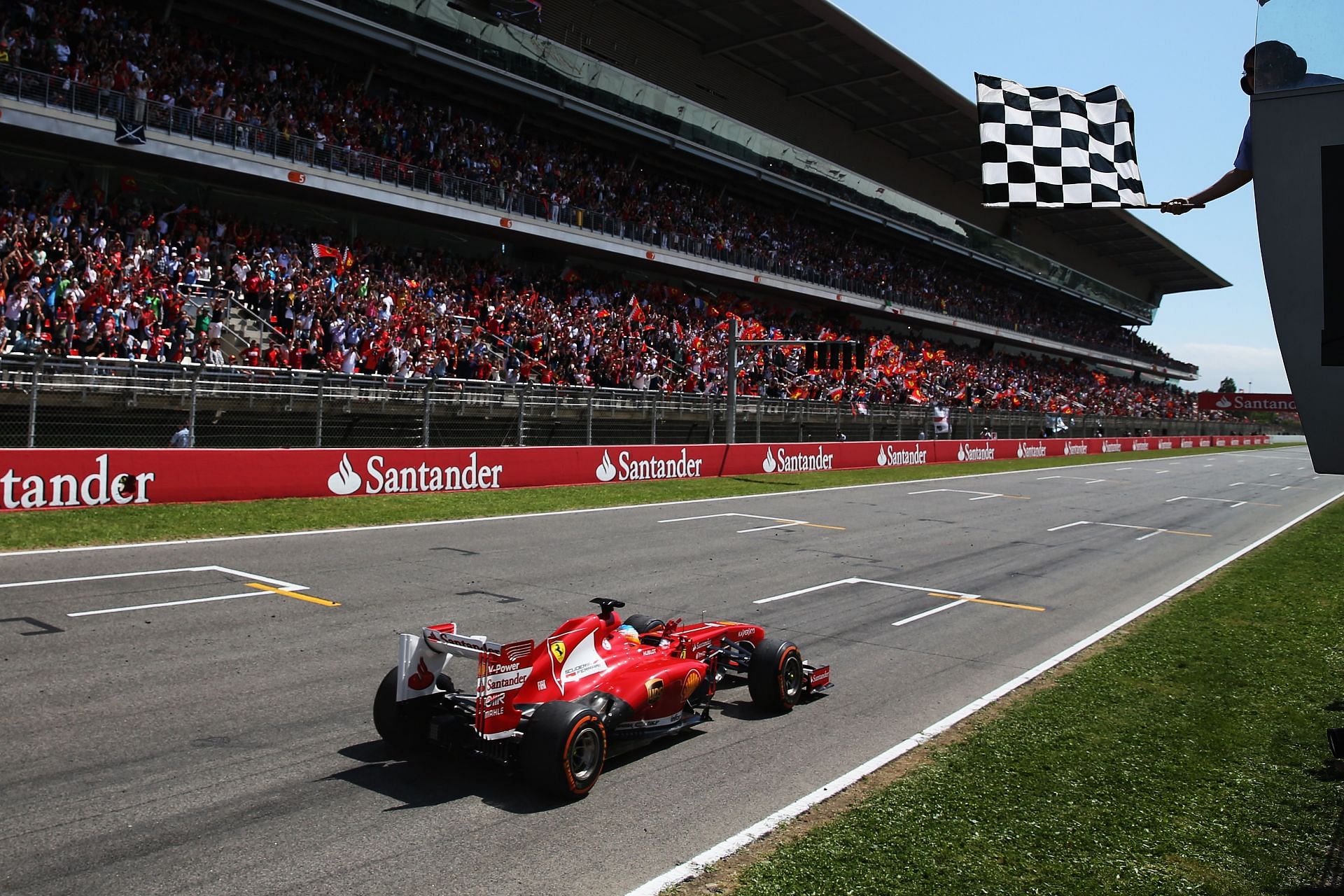 Alonso crossing the checkered flag at the 2013 Spanish F1 Grand Prix