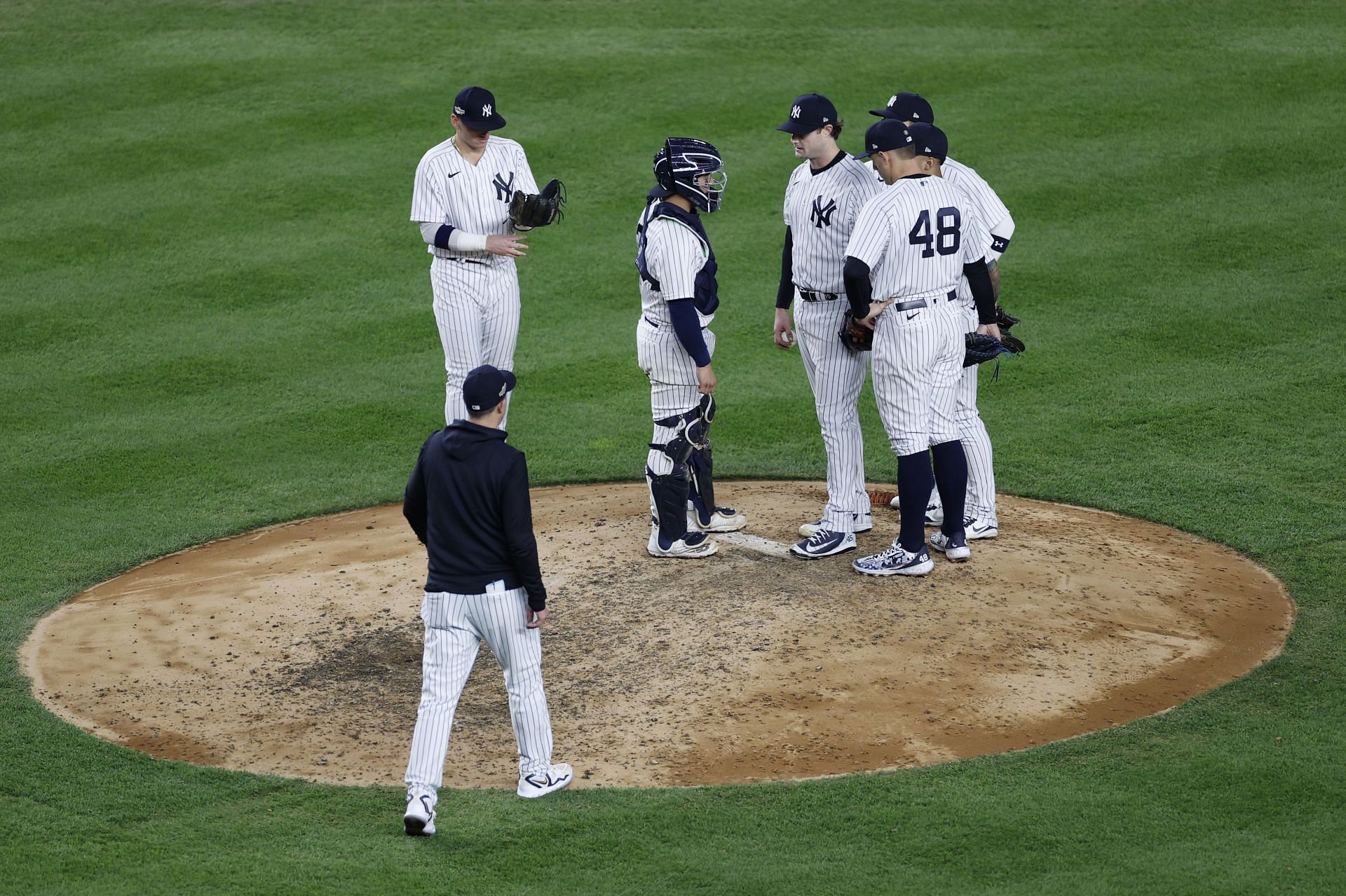 Manager Aaron Boone walks to the mound to remove starting pitcher Gerrit Cole against the Houston Astros