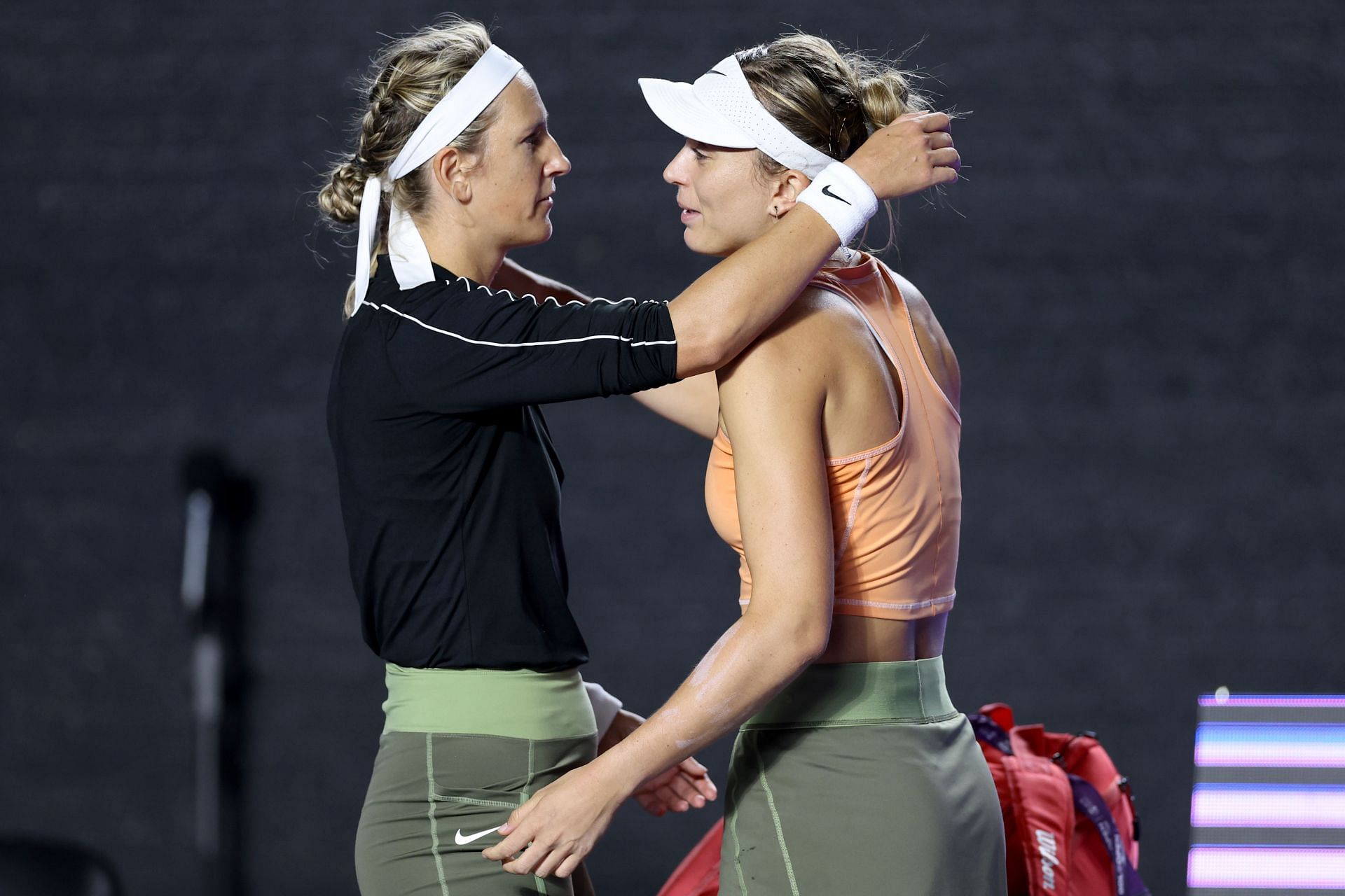 Victoria Azarenka (L) and Paula Badosa