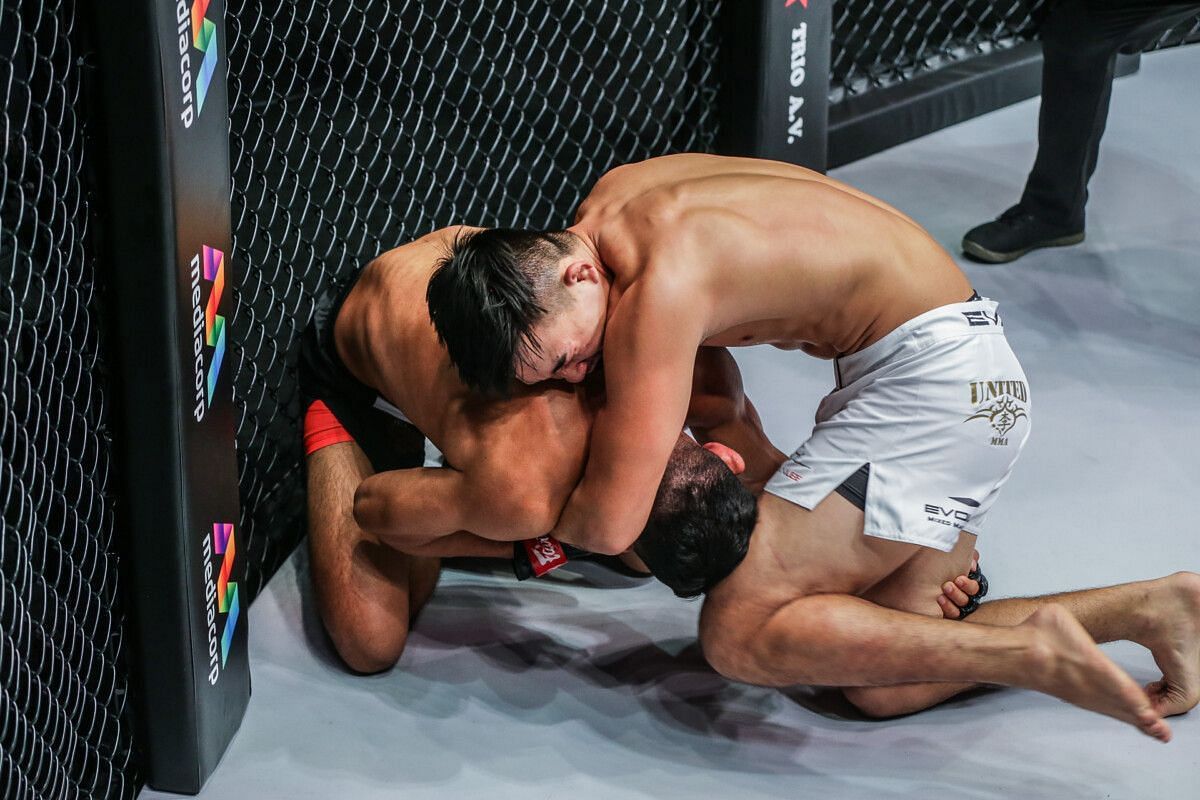 Christian Lee (right) tags Ok Rae Yoon with a knee strike. [Photo ONE 160]