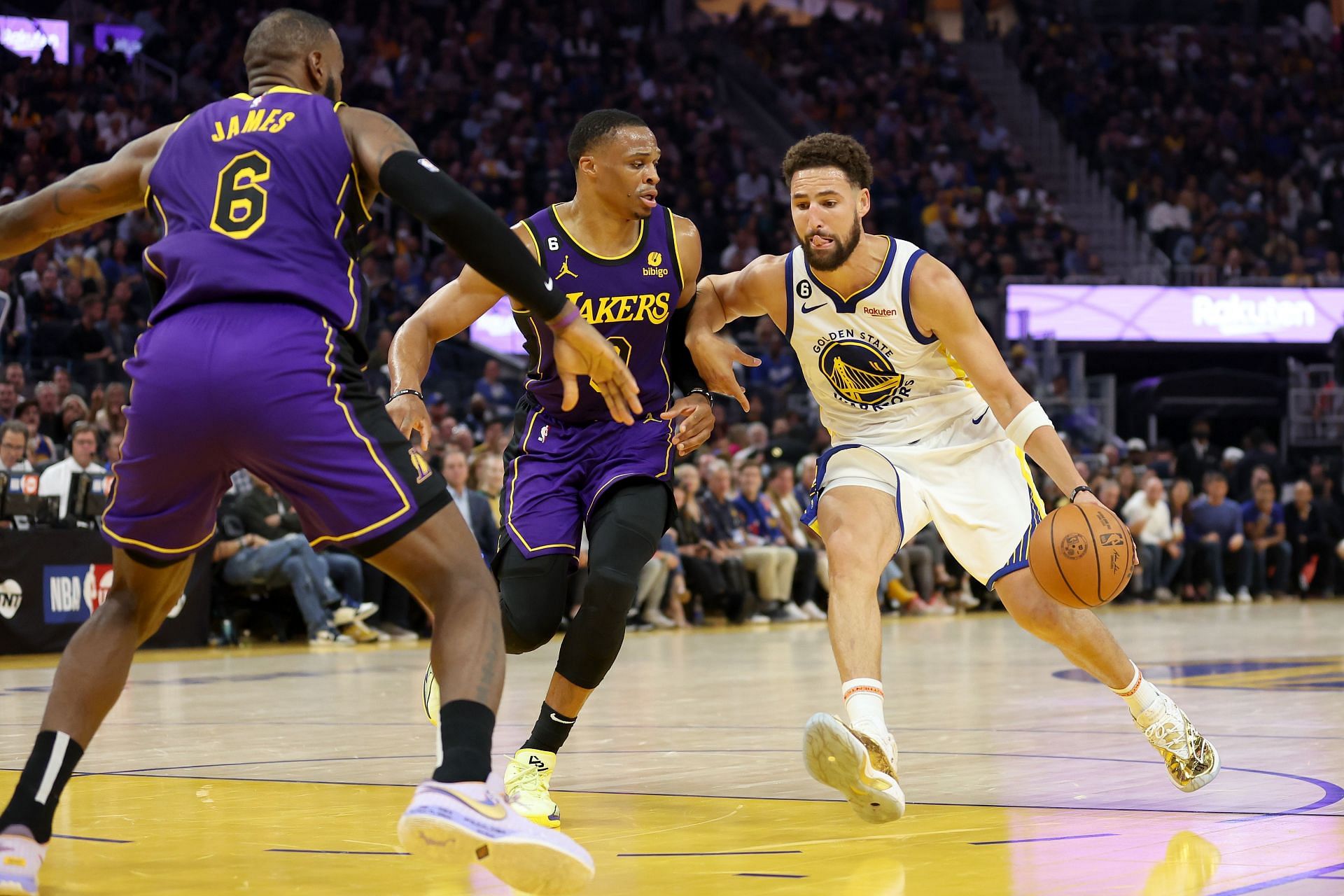 Klay Thompson of the Golden State Warriors is guarded by Russell Westbrook of the Los Angeles Lakers