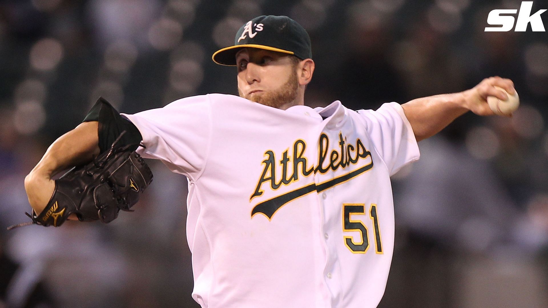 Former Oakland Athletics pitcher Dallas Braden wears a jersey of