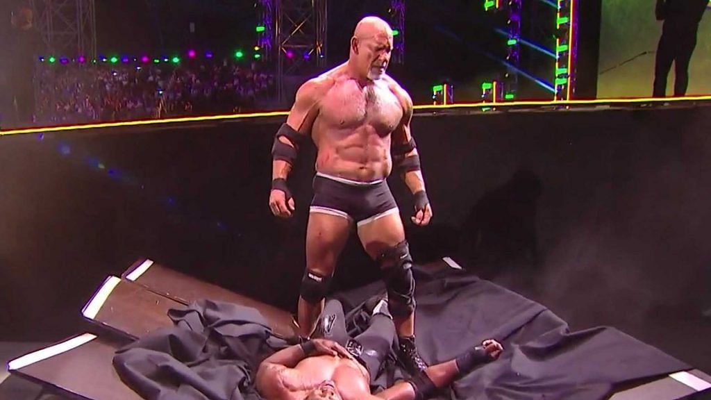 Goldberg standing tall over Bobby Lashley in their epic rematch