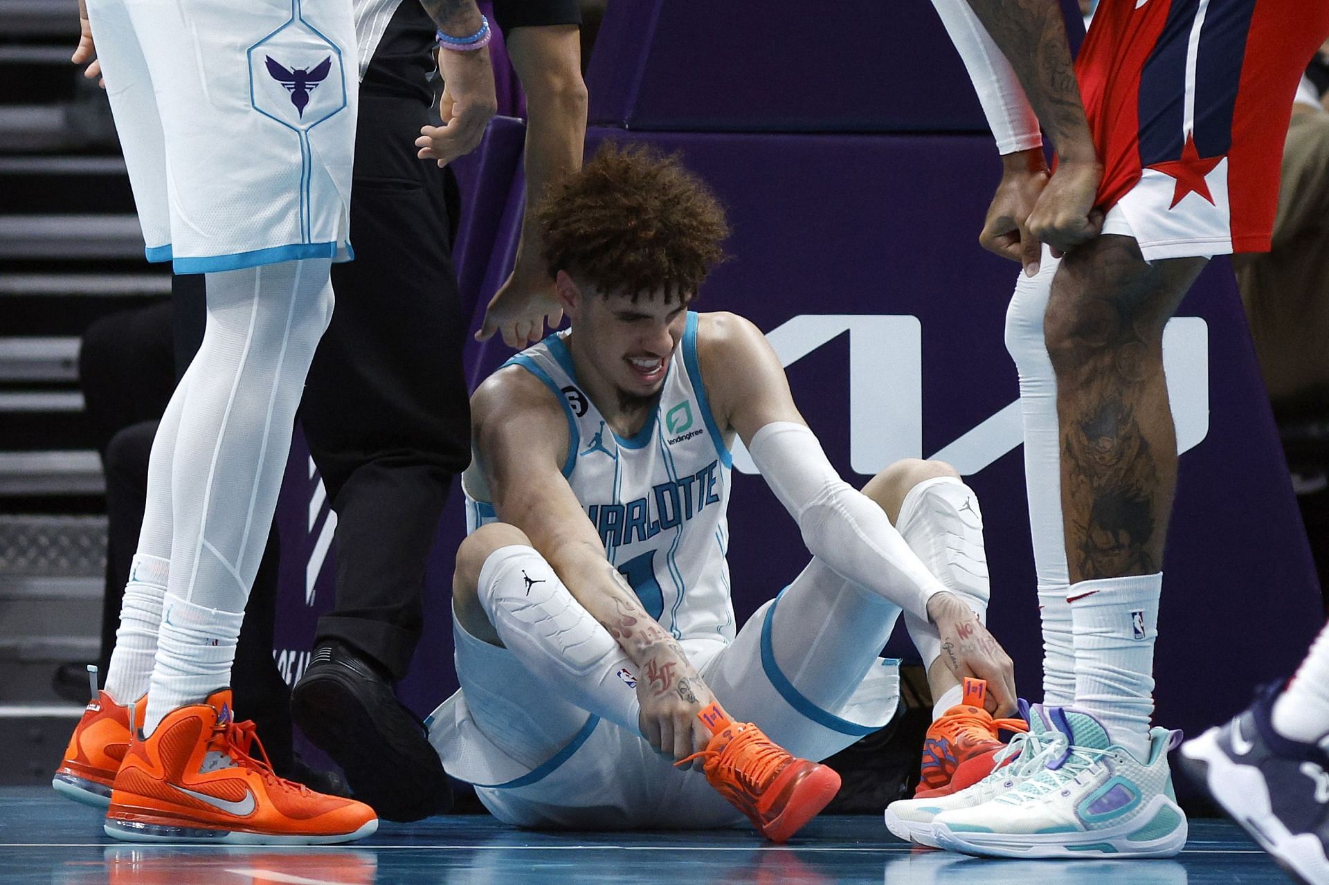LaMelo of the Charlotte Hornets reacts after suffering a knock