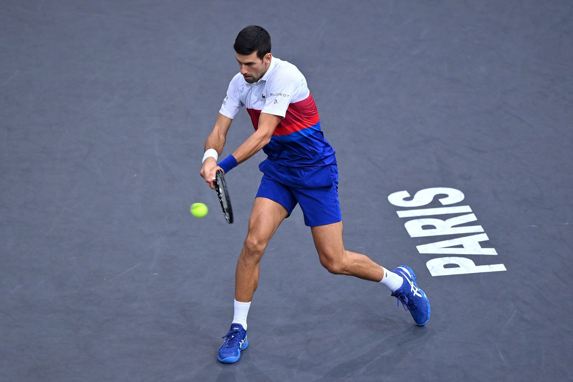 Novak Djokovic plays a backhand during the mens singles final against Daniil Medvedev at the 2021 Rolex Paris Masters