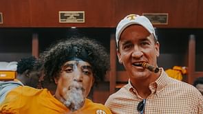Peyton Manning smokes cigar provided by Jay Cutler after Tennessee's upset win over Alabama