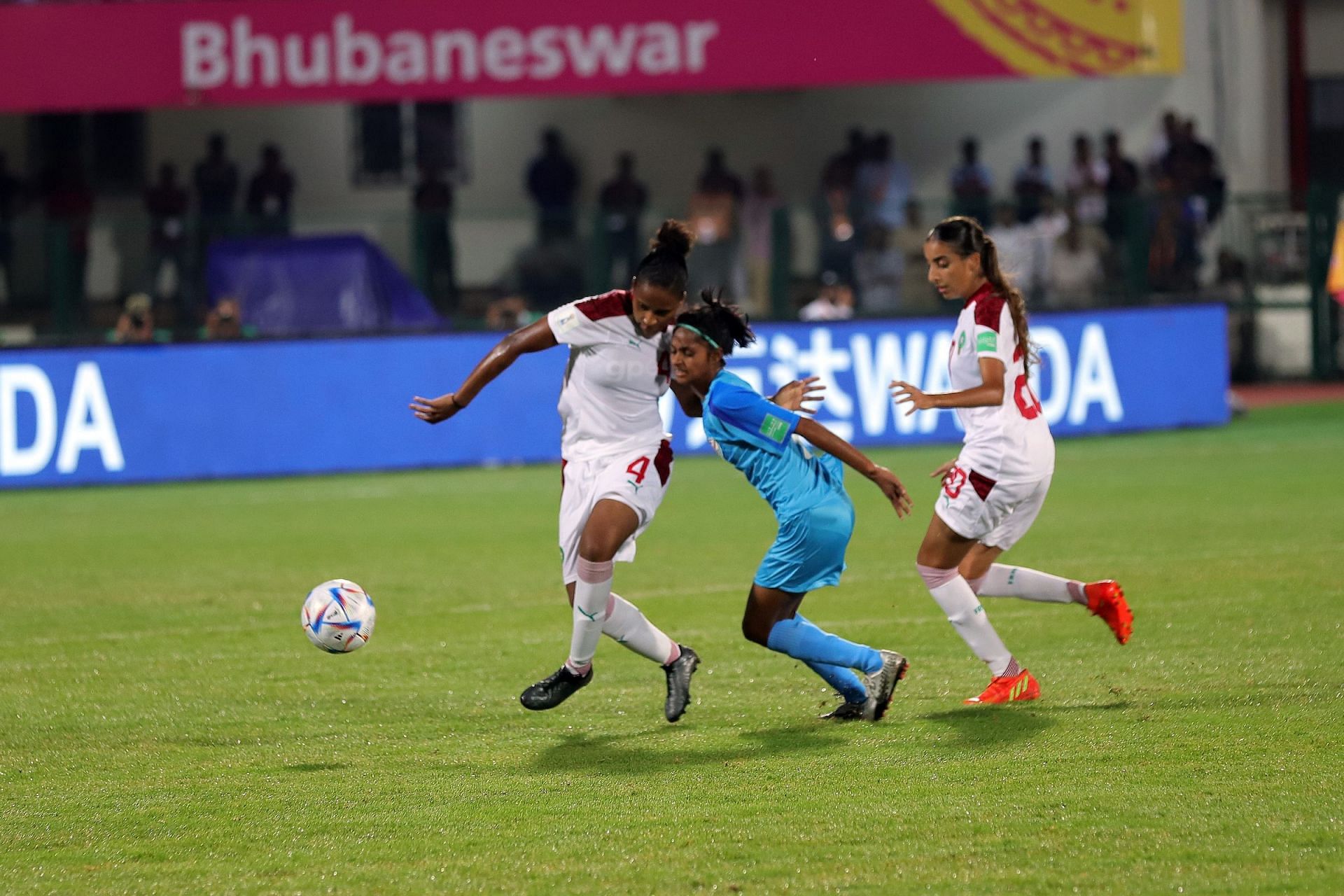India and Morocco players fighting for the ball in the middle.
