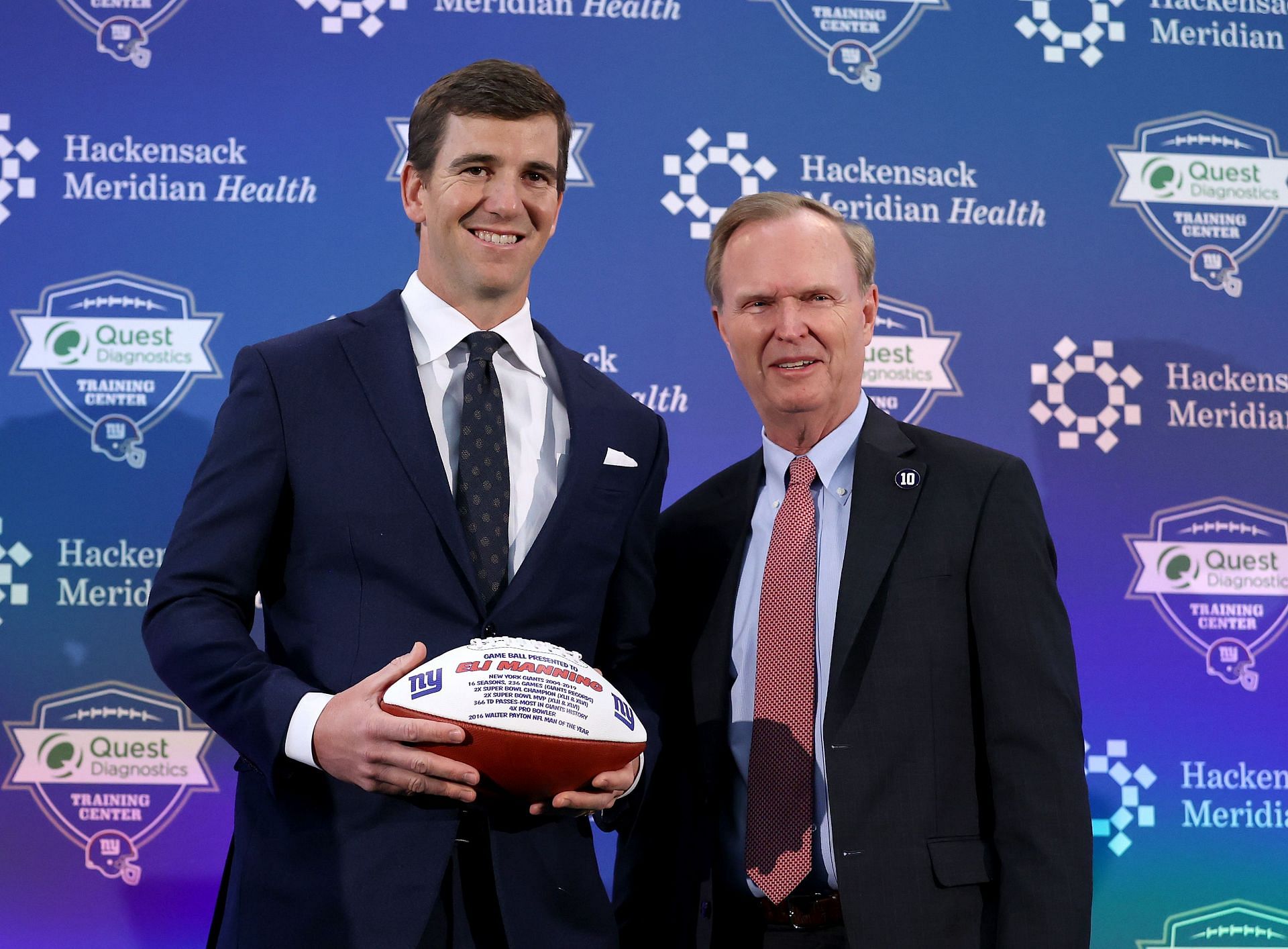 Eli Manning and John Mara