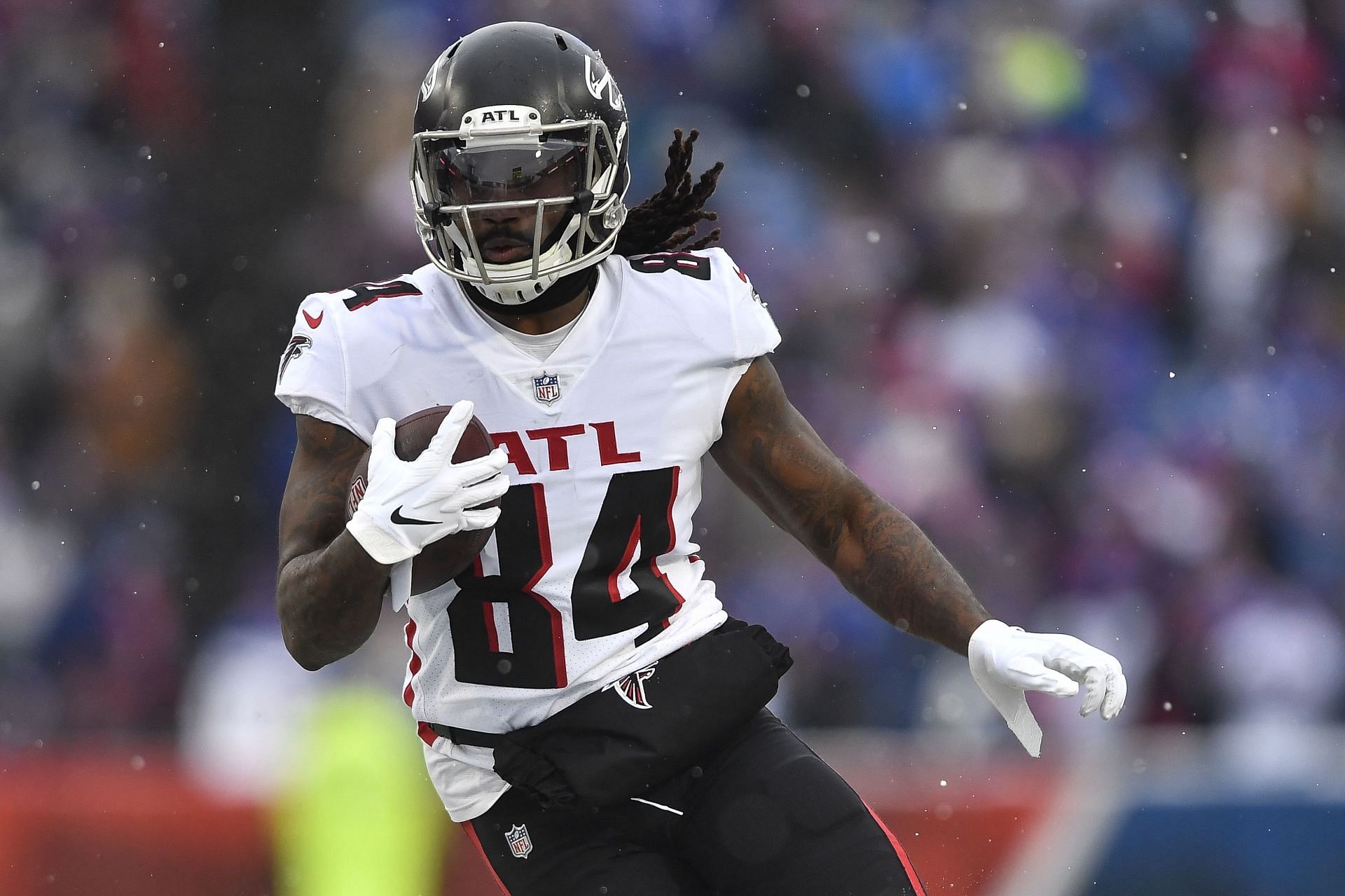 Cordarrelle Patterson of the Atlanta Falcons holds a sign from a