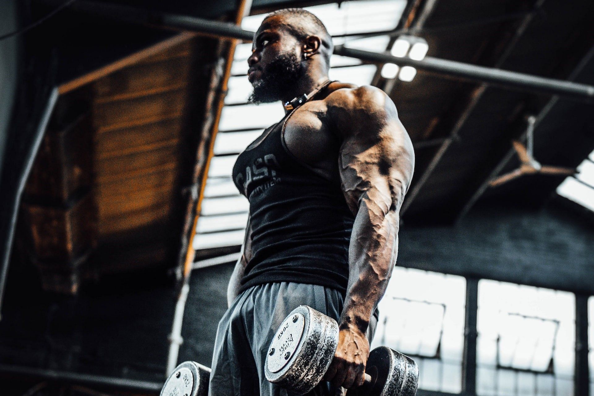 What can you do to build muscle faster? (Photo via Aaron Brogden/Unsplash)
