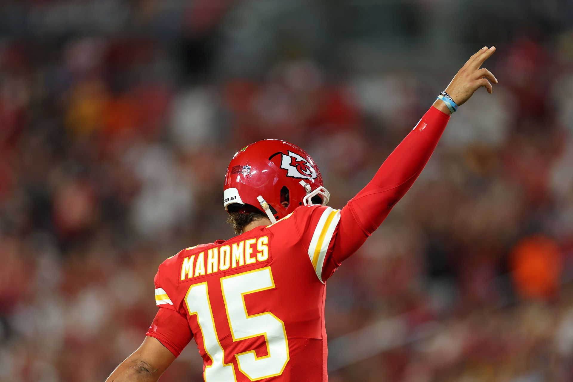 Kansas City Chiefs quarterback Patrick Mahomes (15) sticks out his tongue  at teammates while playing the Las Vegas Raidersduring an NFL Professional  Football Game Sunday, Nov. 14, 2021, in Las Vegas. (AP