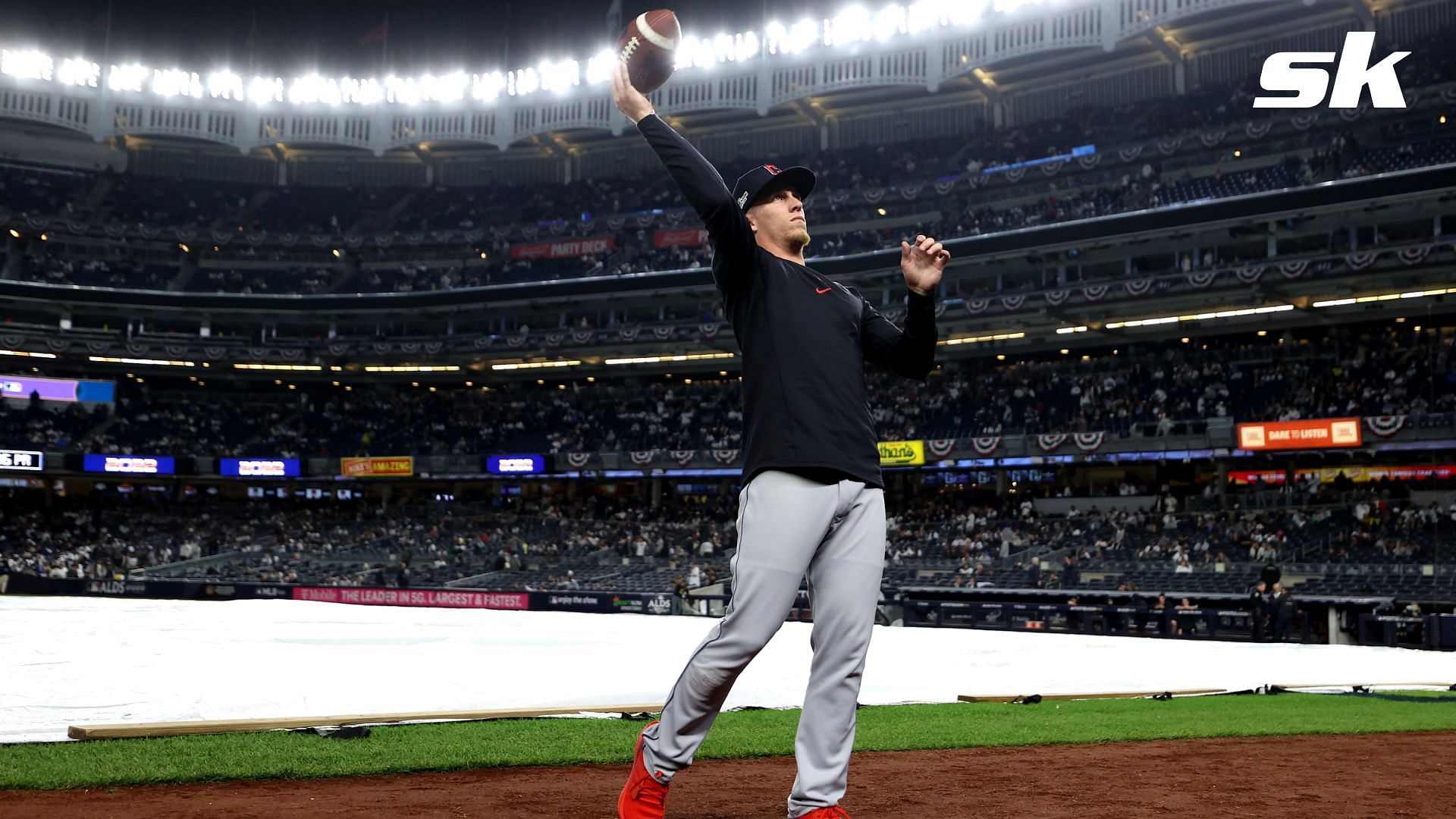 Myles Straw was spotted tossing a football around with the Yankees fans during the Game 5 rain delay