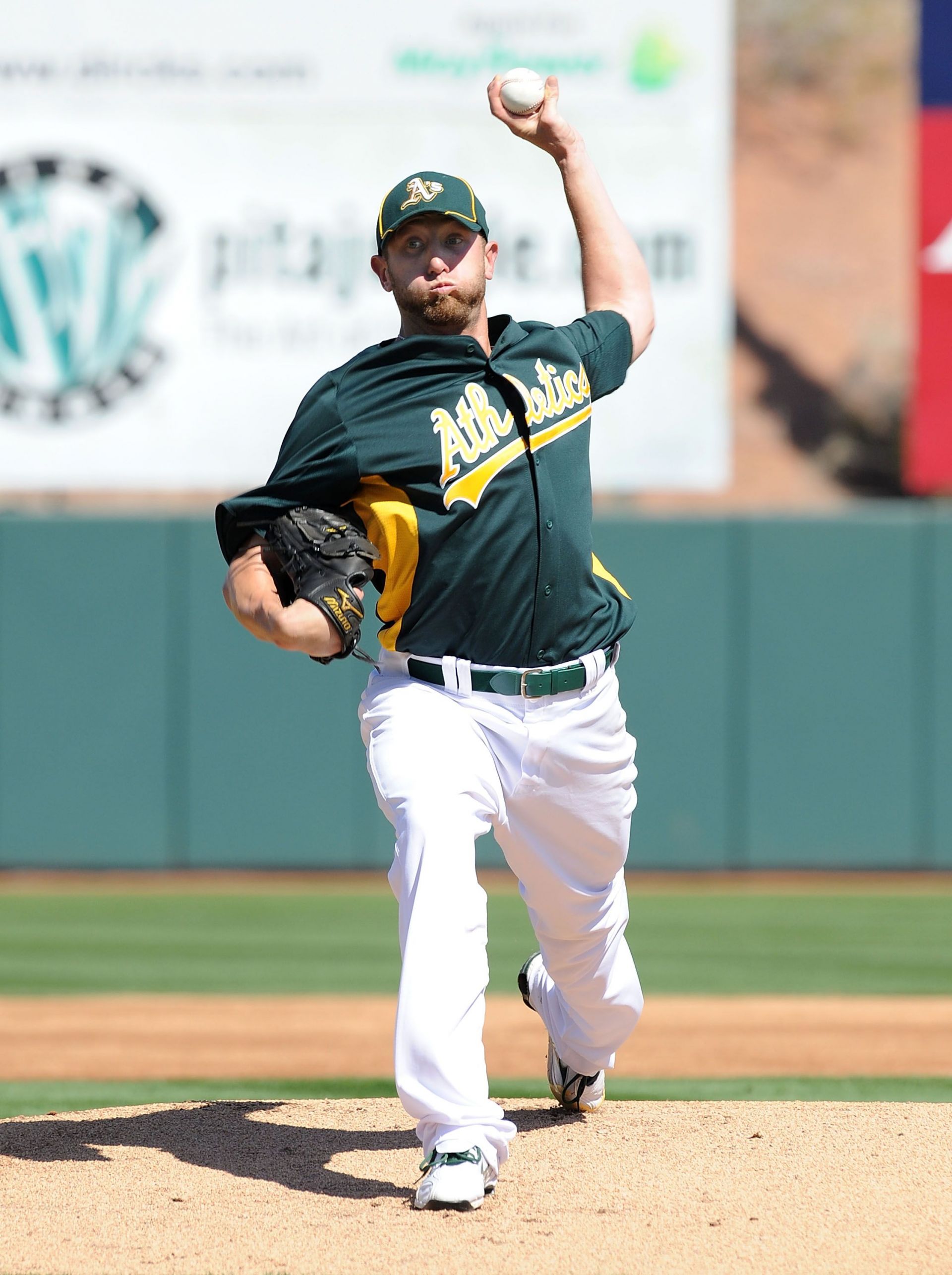 Former Oakland Athletics pitcher Dallas Braden wears a jersey of