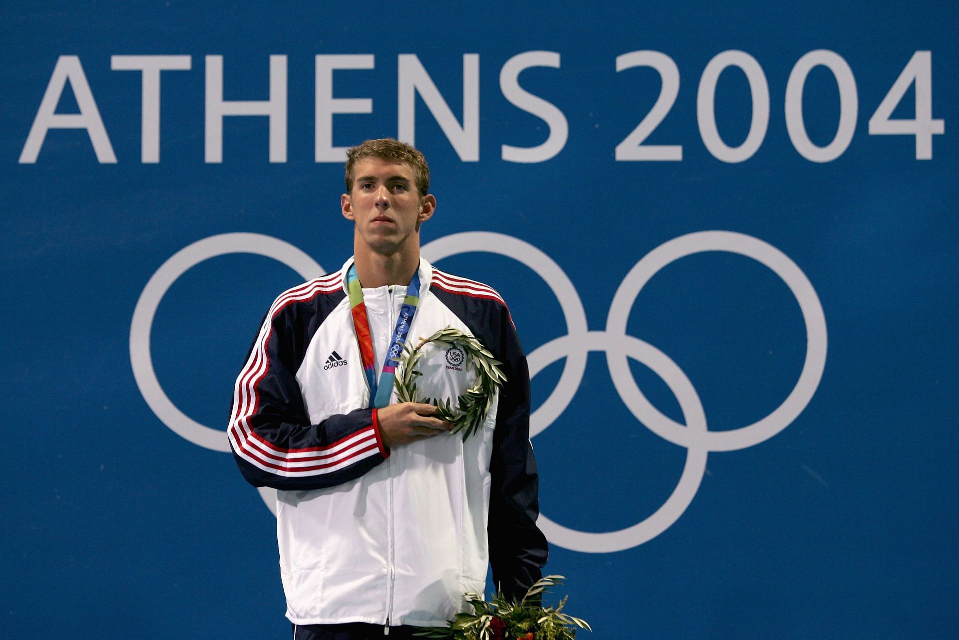 Michael Phelps during the Mens 100m Butterfly Medal Ceremony of 2004 Olympics