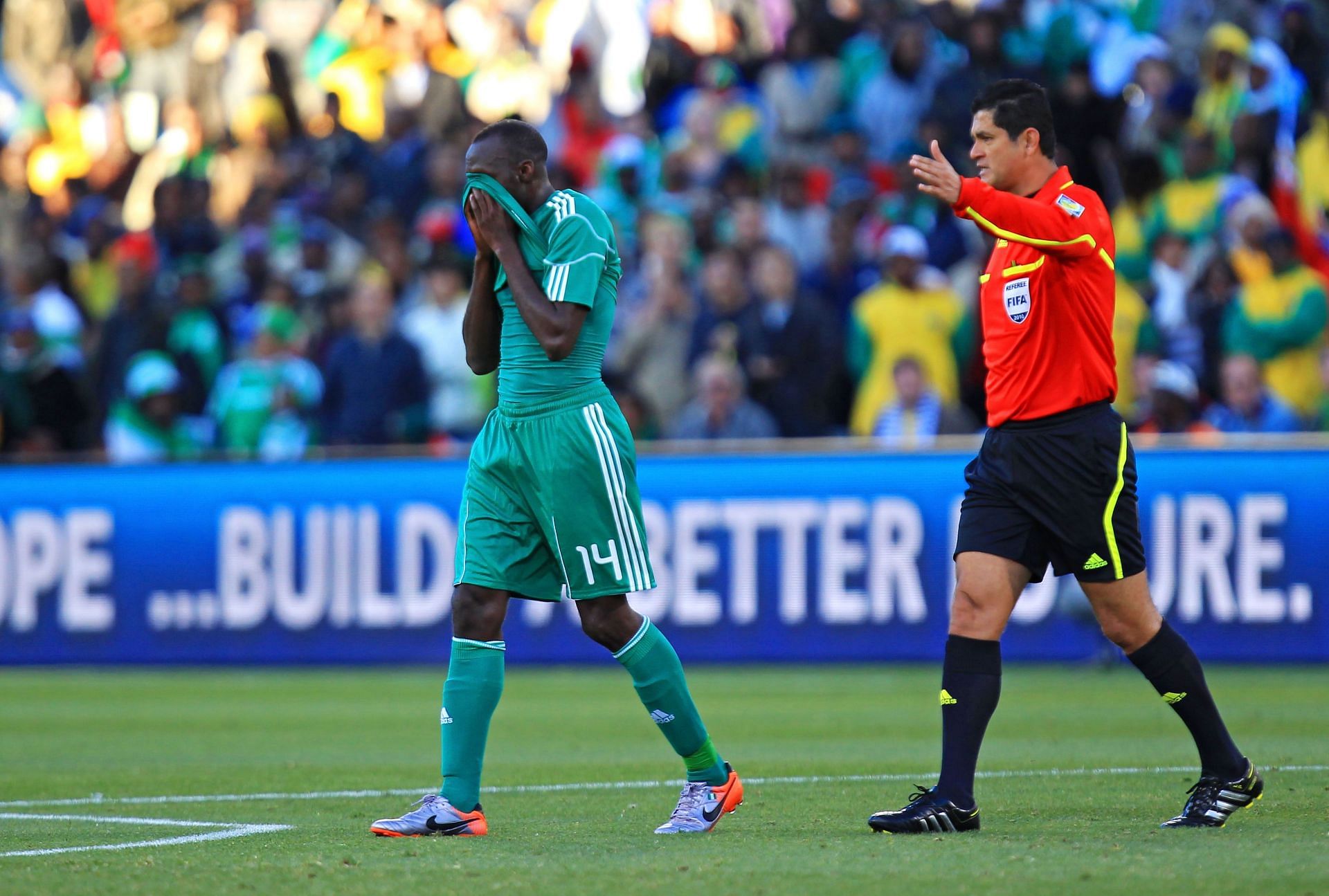 Sani Kaita of Nigeria is sent off by referee Oscar Ruiz during the 2010 FIFA World Cup South Africa Group B match between Greece and Nigeria.