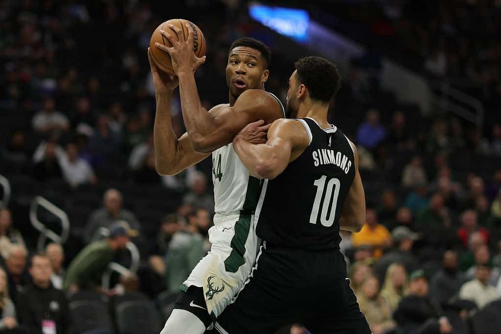 Giannis Antetokounmpo posts up against Ben Simmons [Photo source: The Cold Wire]