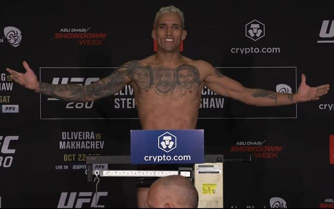 Breaking: Charles Oliveira makes a statement as he steps onto the scales first and makes 154.5 lbs comfortably