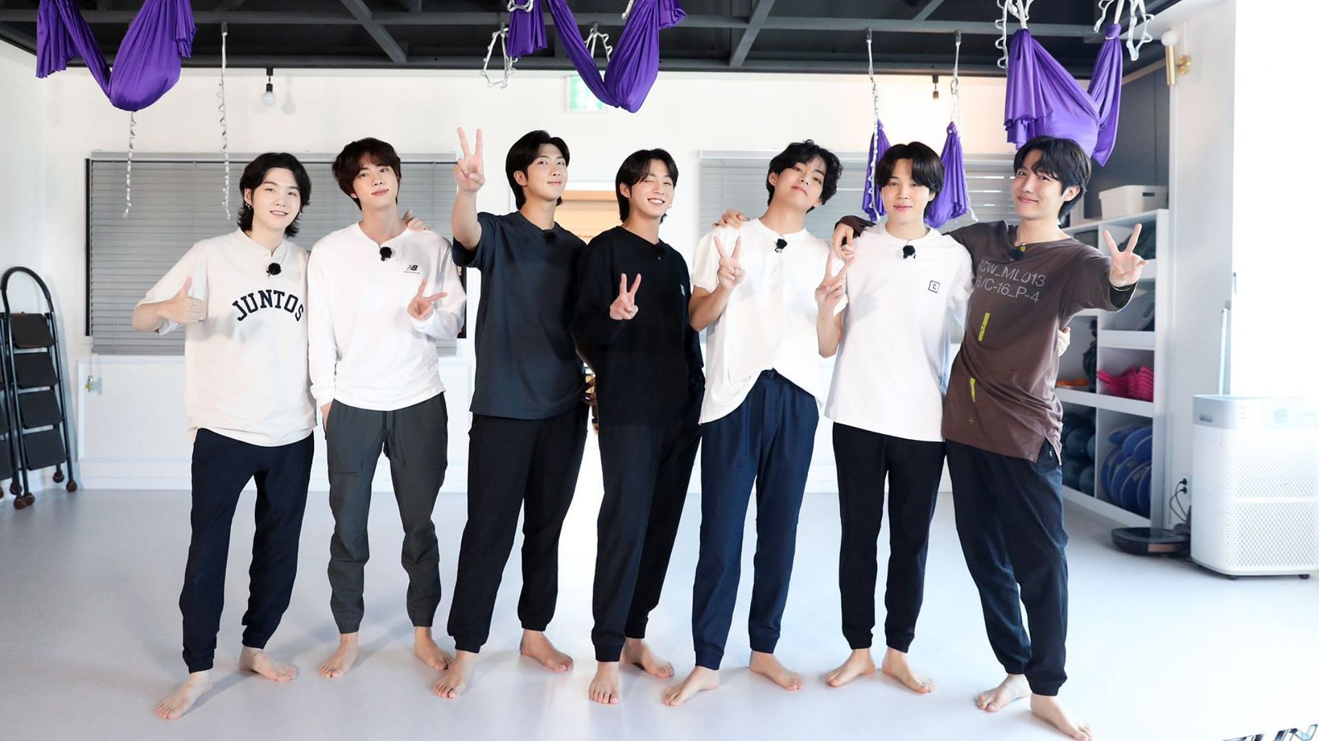 The band pose for the Run BTS Flying Yoga episode. (Image via Weverse/ BTS)