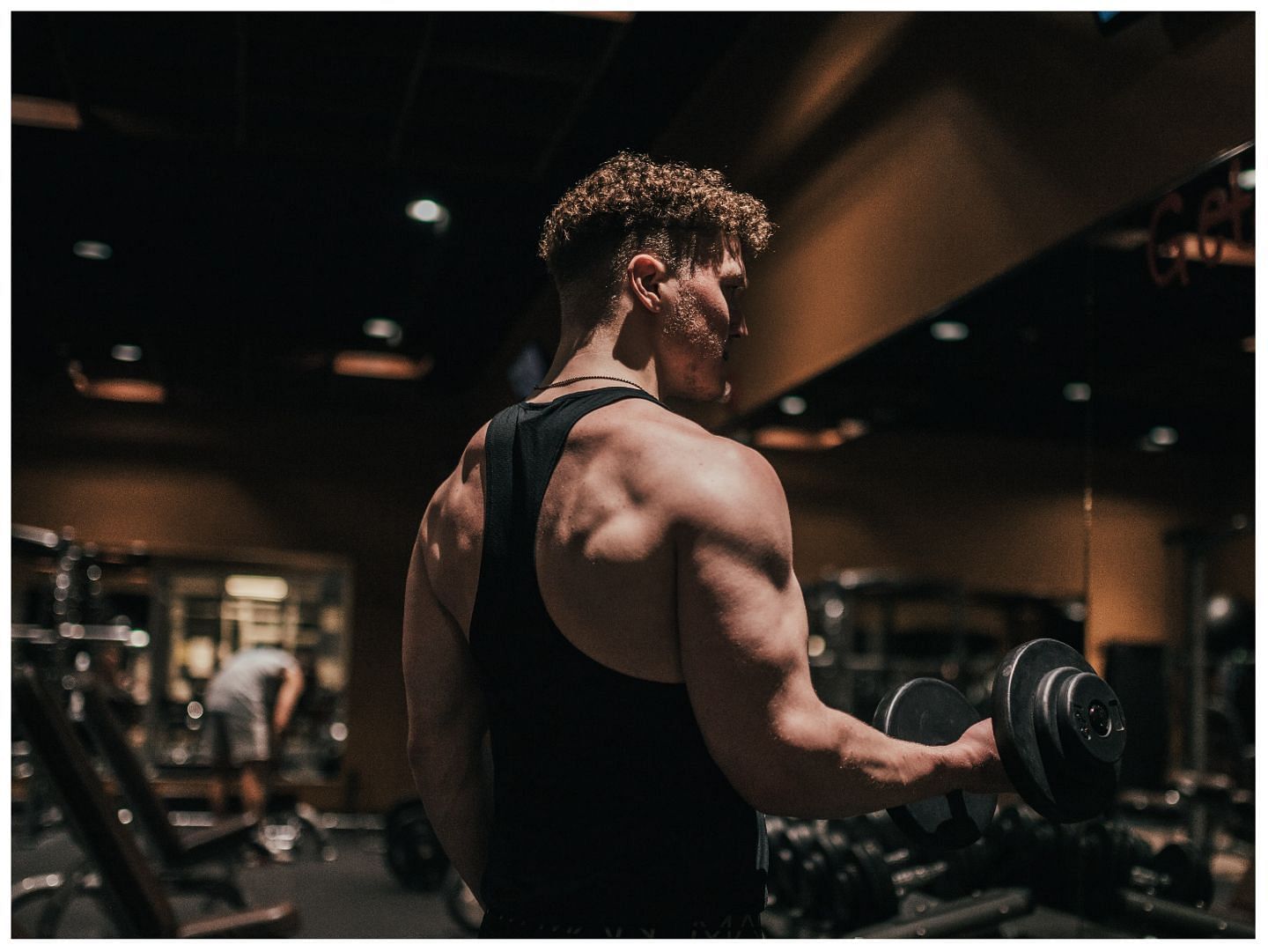 Want to build strong and muscular arms? Try these five effective bicep exercises. (Image via Unsplash /Luke Witter)