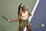 Sloane Stephens returns a shot against Aryna Sabalenka at the San Diego Open - Day 4