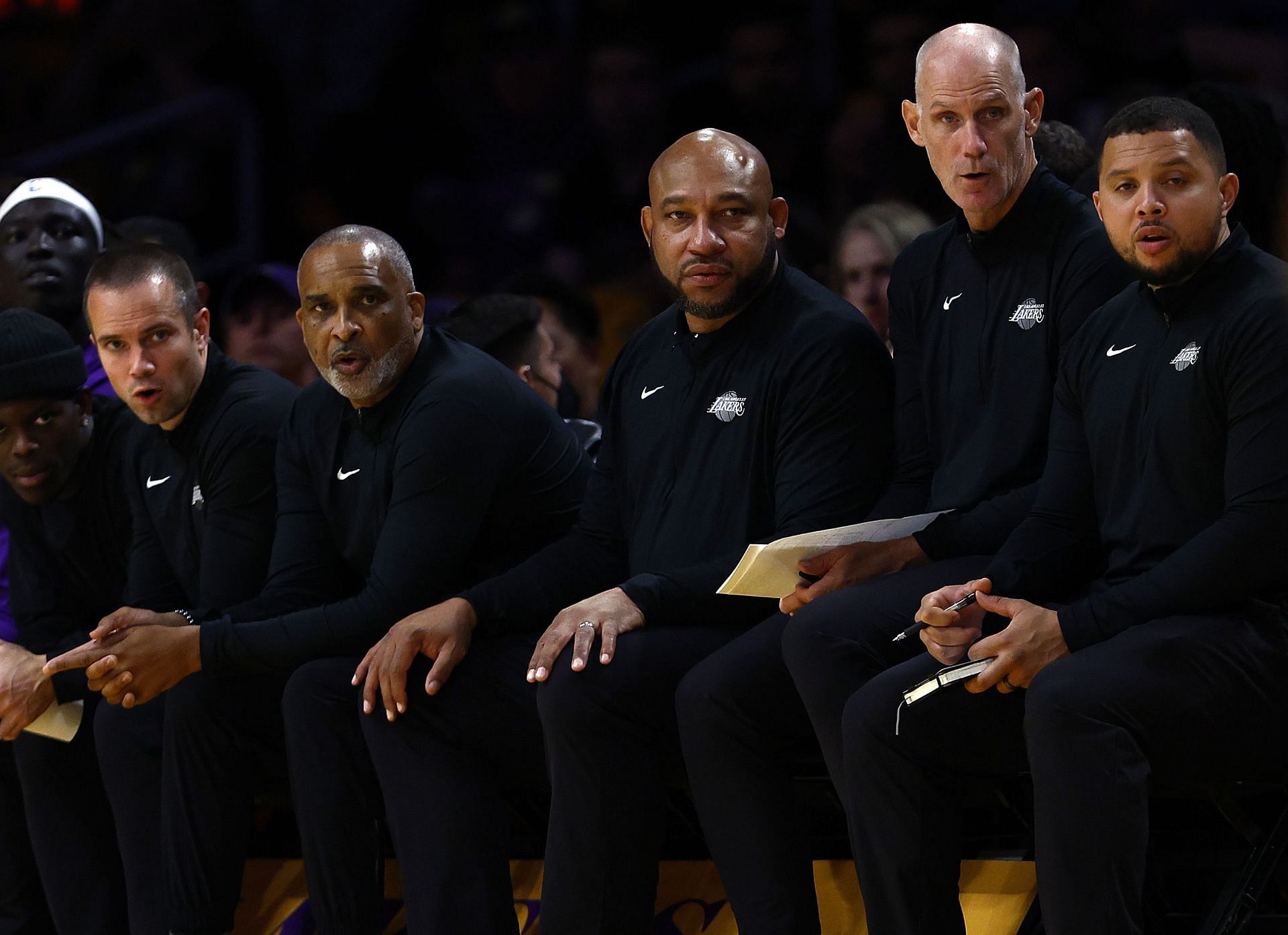 LA Lakers' coaching staff looks on during the game.