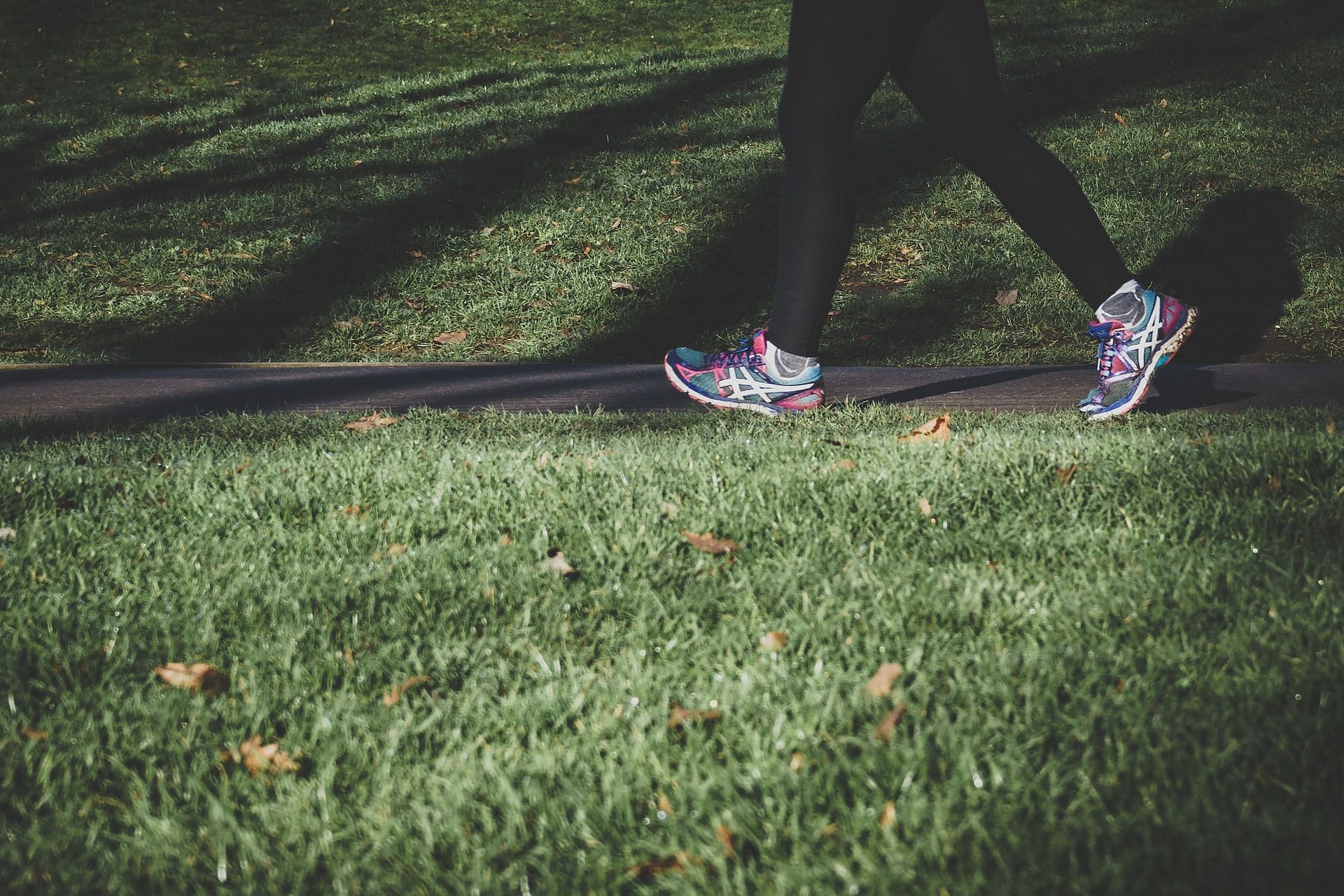 Find out how many calories you burn while walking a mile. (Photo via Arek Adeoye/Unsplash)