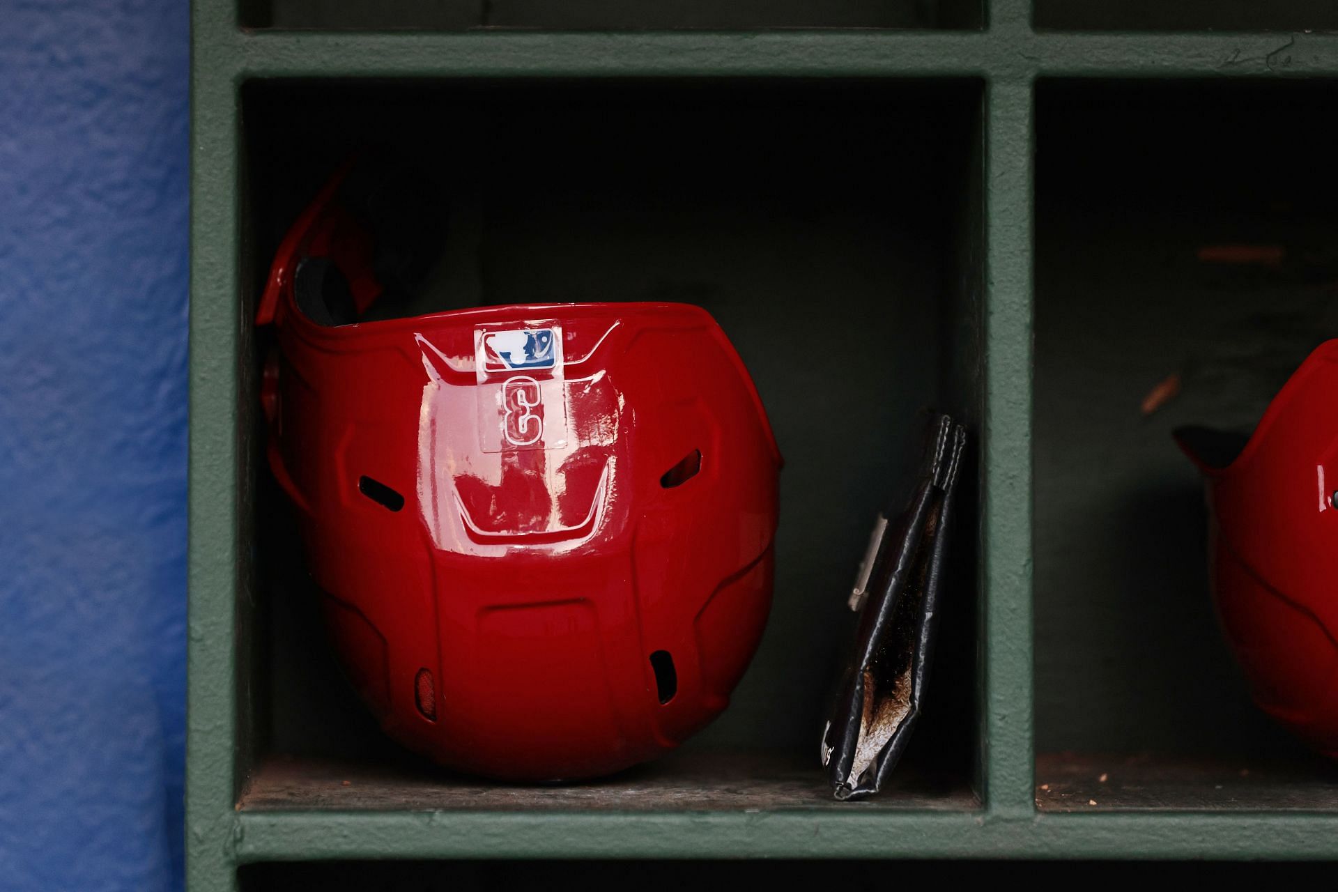 A Philadelphia Phillies helmet sits in the dugout before a game at Citizens Bank Park.